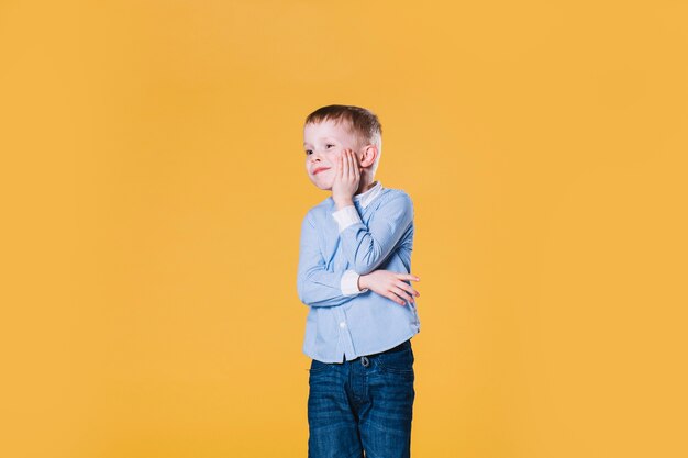 Puzzled boy looking away