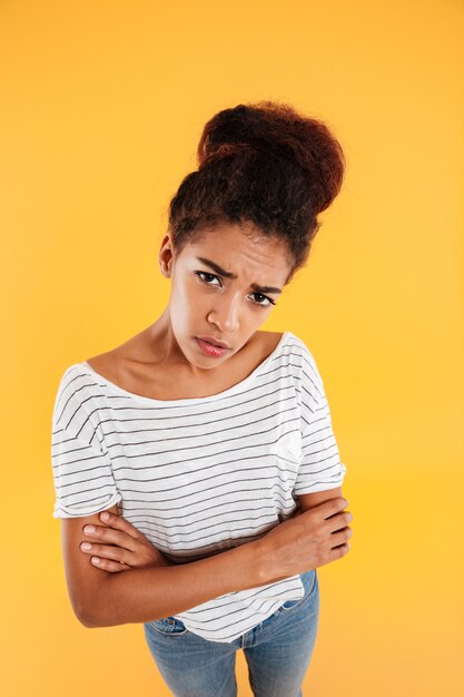 Puzzled displeased lady looking up isolated