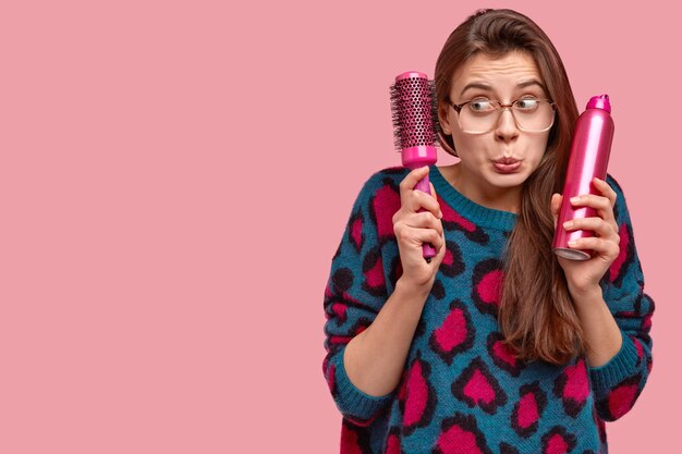 Puzzled young girlfriend visits luxury beaty salon, looks in displeasure aside