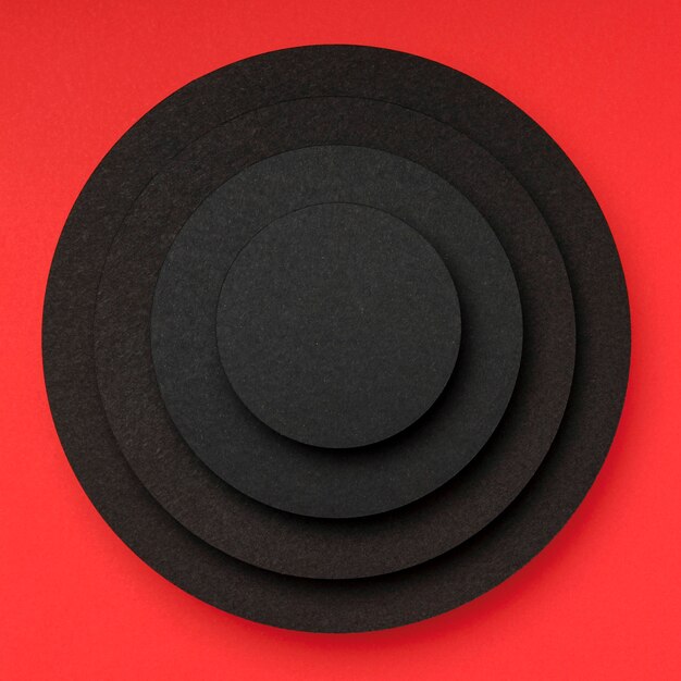 Pyramid of circular pieces of black paper