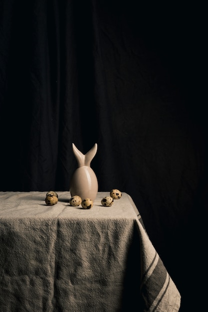 Quail eggs and abstract figure on napkin