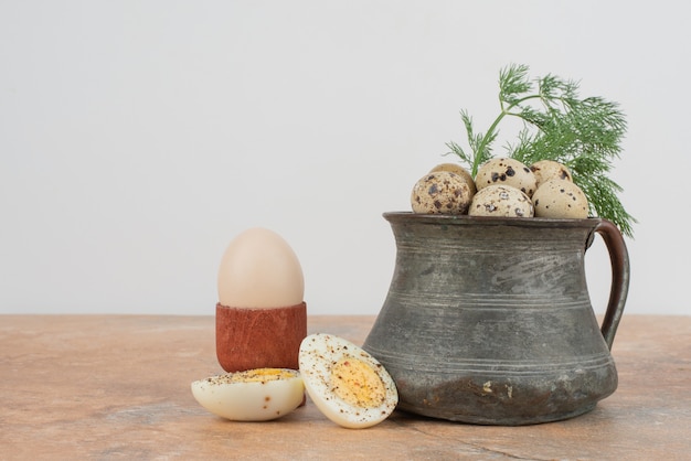 Quail eggs on the cup in the marble table .