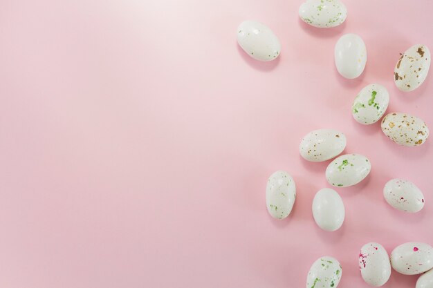 Quail eggs on pink