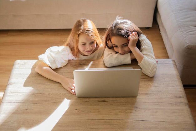 Quarantined little girls watching a video