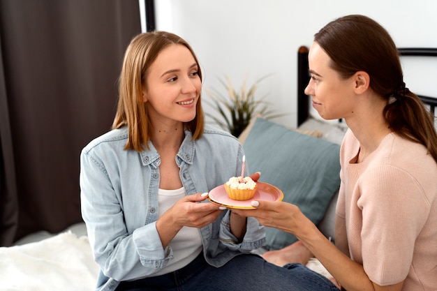 Queer couple celebrating birthday together