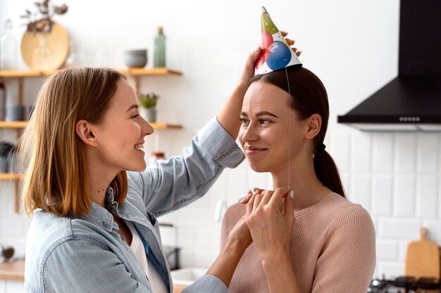 Queer couple celebrating birthday together