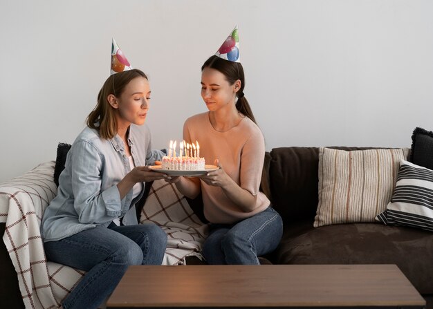 Queer couple celebrating birthday together