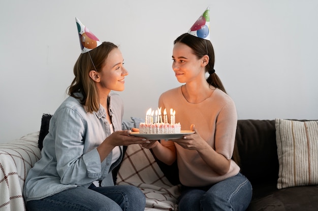 Free photo queer couple celebrating birthday together