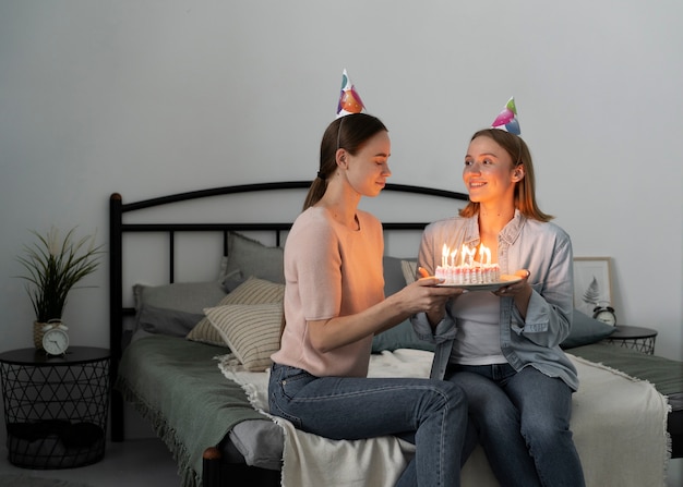 Queer couple celebrating birthday together