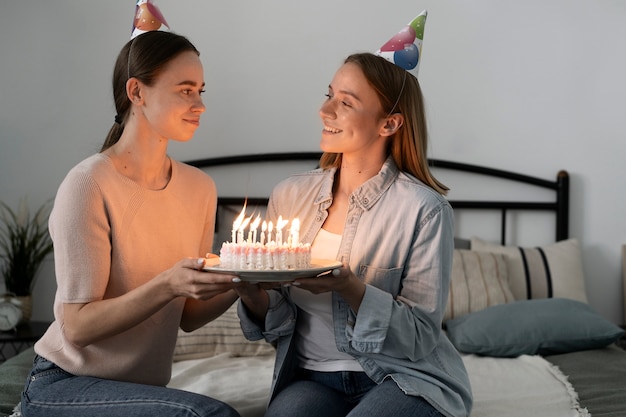 Queer couple celebrating birthday together