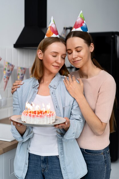 Queer couple celebrating birthday together