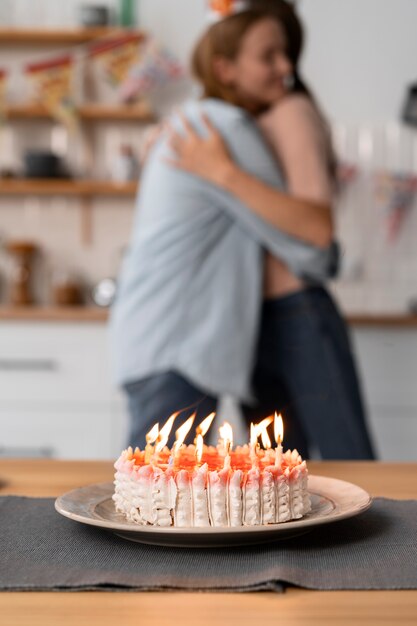 Queer couple celebrating birthday together