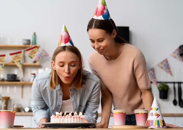 Queer couple celebrating birthday together