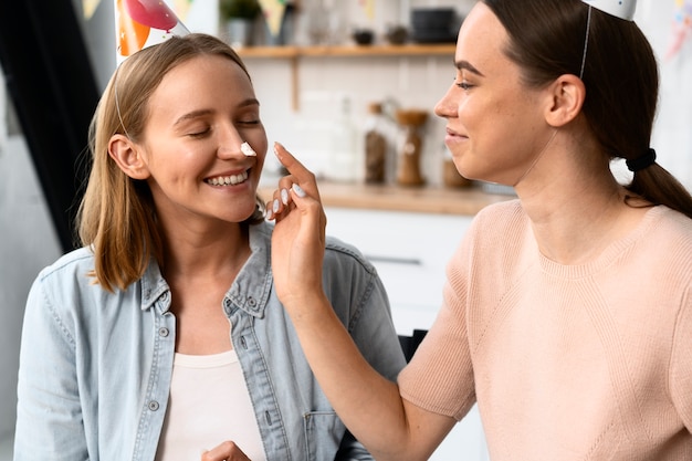 Queer couple celebrating birthday together