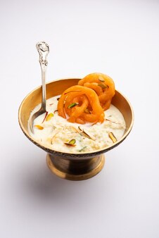 Rabri jalebi or imarati with rabdi made from condensing milk, famous dessert sweet from india