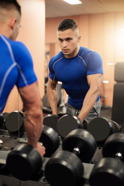 Free photo rack full of different dumbbells