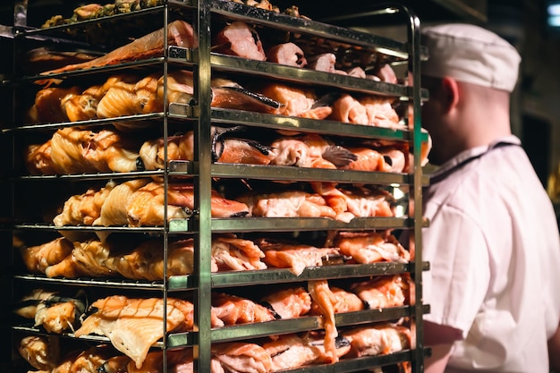 Racks of salmon smoking in a small smoker