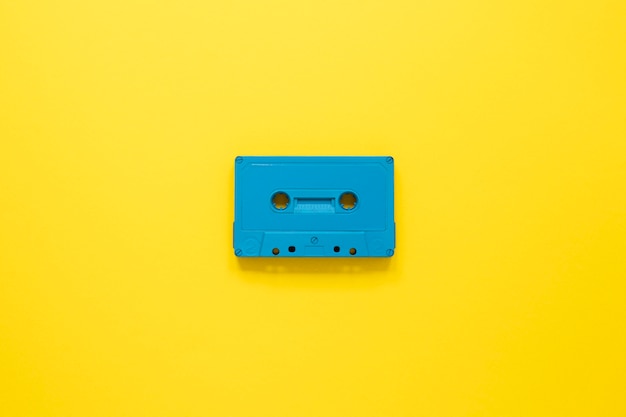 Radio concept with cassette on yellow background