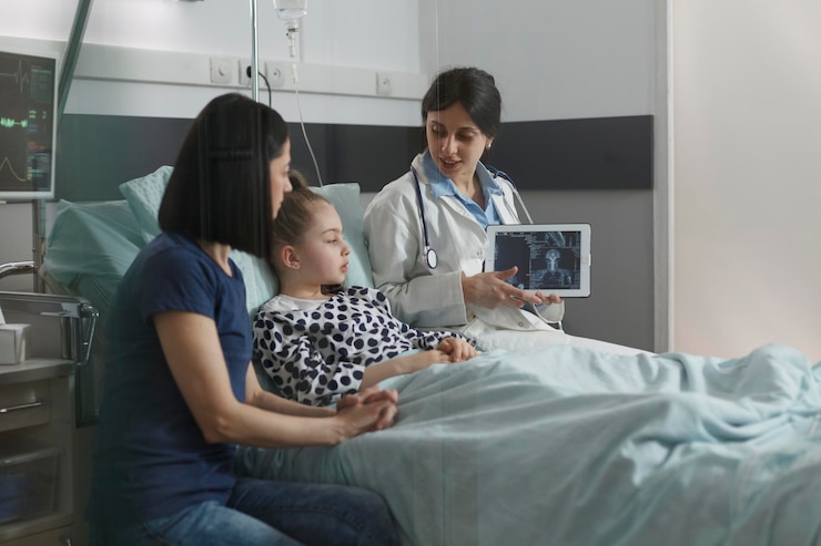 Free Photo radiology expert examining radiography scan image of sick little girl resting in hospital pediatric ward. radiologist showing xray scanning result of under treatment kid brain condition.