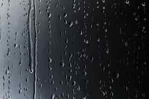 Free photo rain drops on glass textured background