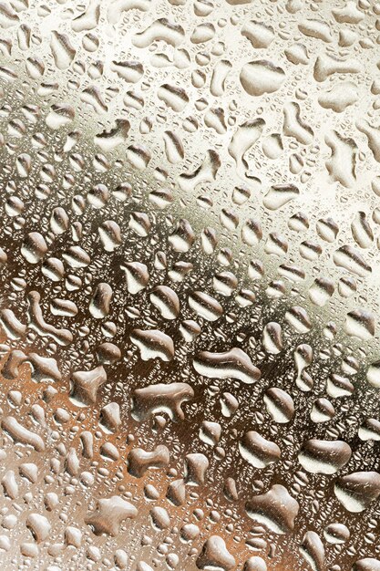 Rain drops on gradient brown metallic wall