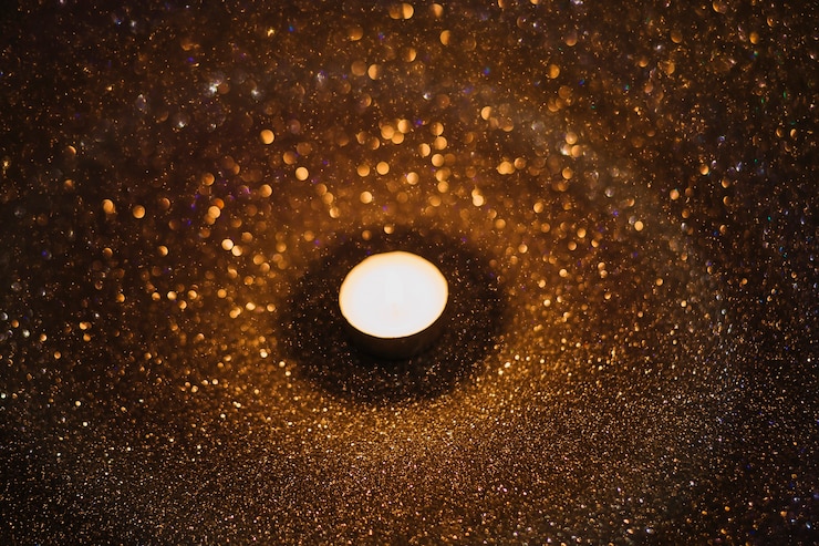 Free Photo rain falling around candle