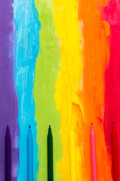 Rainbow colored background with markers