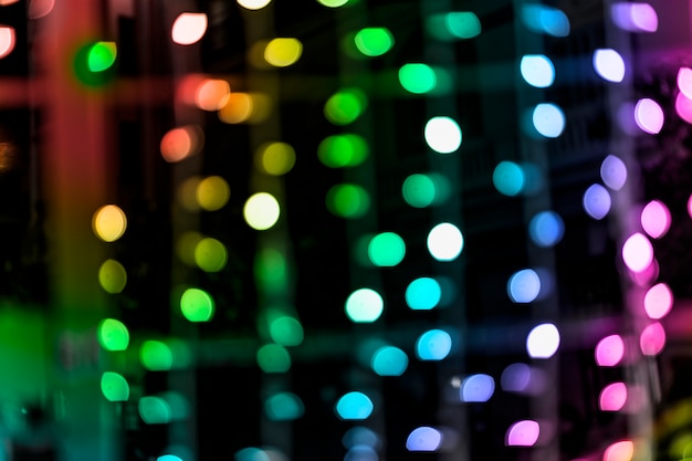 Rainbow colored glittering shine bulbs lights background