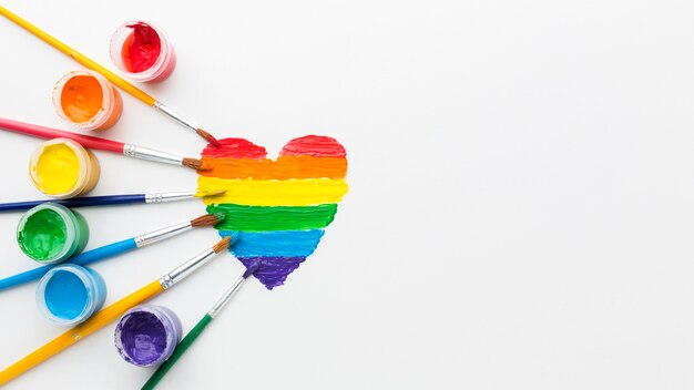 rainbow containers of paint for pride love copy space