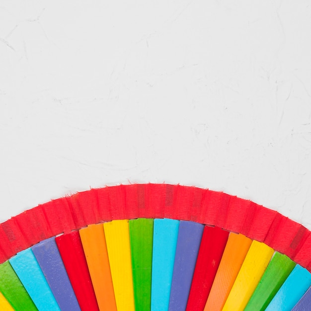 Rainbow fan on white surface