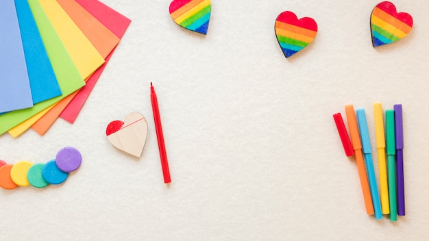 Free photo rainbow heart with felt pens and colored paper