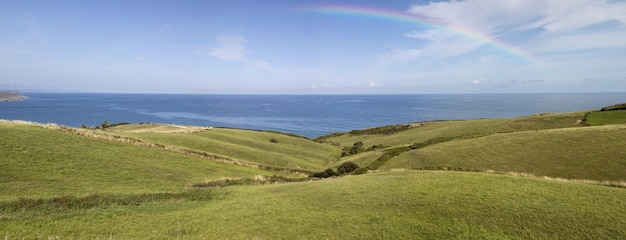 Rainbow in the sky with nature landscape