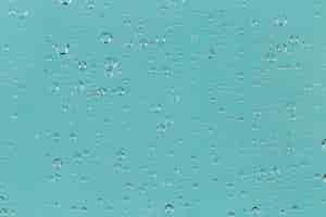 Free photo raindrops on turquoise background