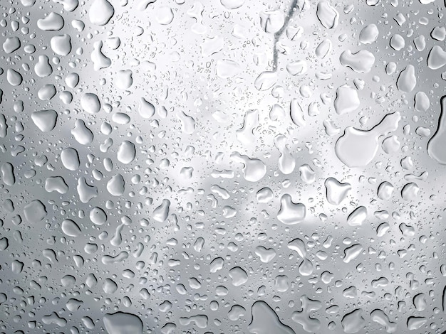 Free photo raindrops on the window closeup abstract natural background