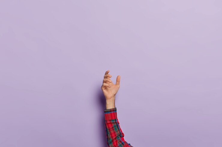 Free Photo raised male hand holding invisible object