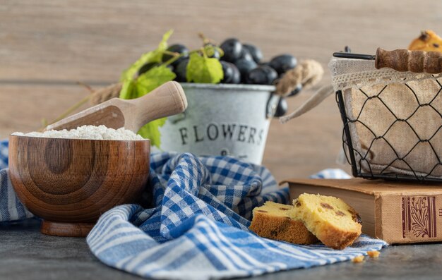 Raisin cake, grapes and flour on marble table