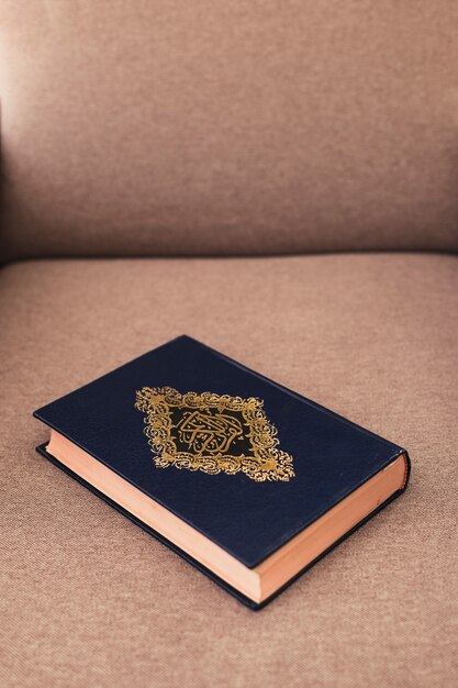 Ramadan concept with quran on couch