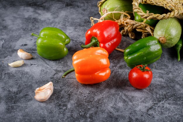 Random selection of colorful peppers and garlics.