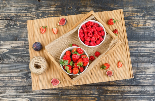 Raspberries in plate with strawberries and figs