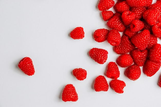 Raspberries top view on a white background