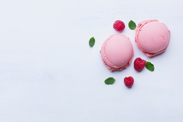 Raspberry ice cream scoops with copy space