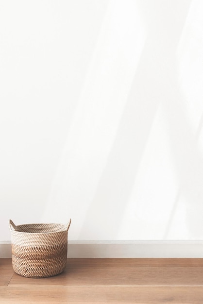 Free photo rattan basket by a blank wall background