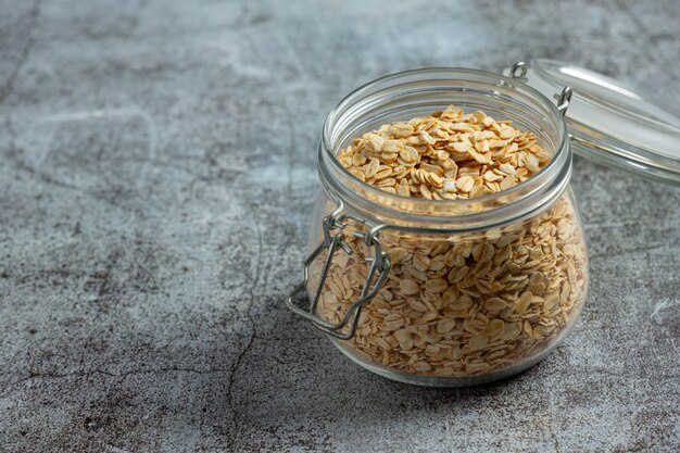 raw barley grain in old dark background