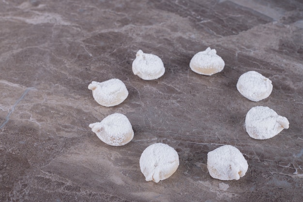 Free photo raw dumplings on marble table.