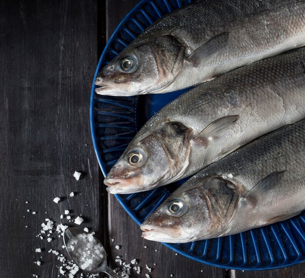 Raw fish arrangement for cooking