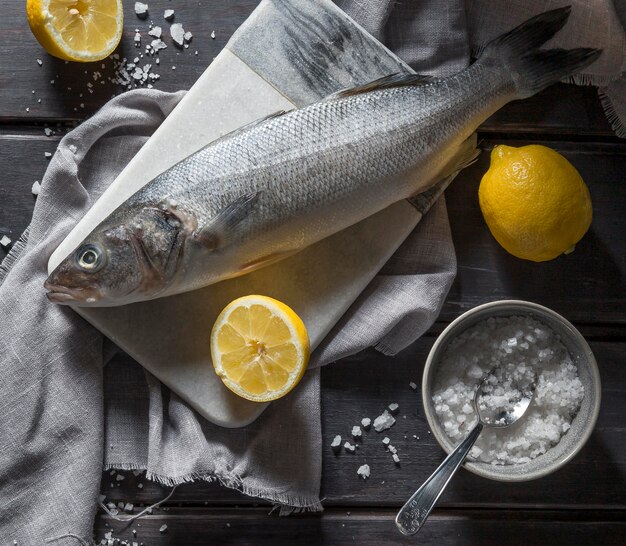 Raw fish arrangement for cooking