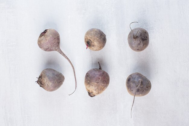 Raw fresh beetroots on stone surface. High quality photo