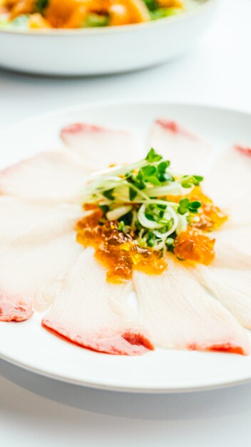 Raw fresh Hamaji fish meat sashimi in white plate