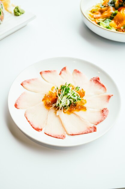 Raw fresh Hamaji fish meat sashimi in white plate