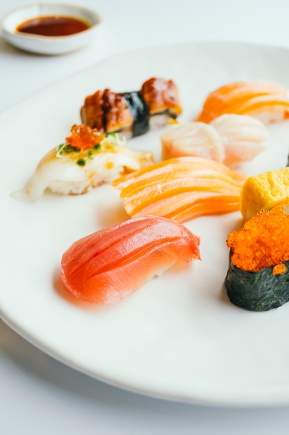 Raw and fresh nigiri sushi set in white plate